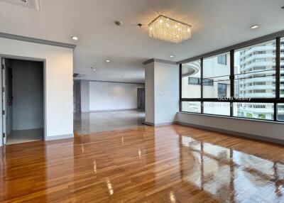 Modern main living area with large windows and wooden flooring