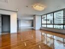 Modern main living area with large windows and wooden flooring