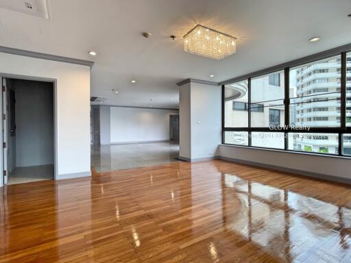 Modern main living area with large windows and wooden flooring