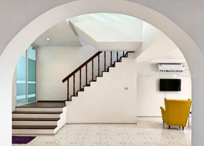 Modern living space with staircase and minimalist decor