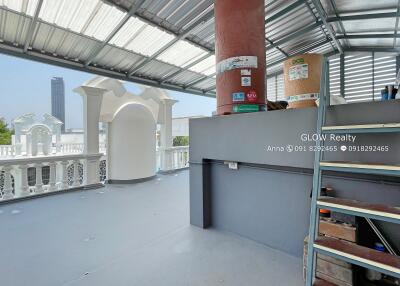 Spacious outdoor terrace with partial roof covering