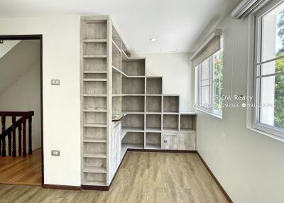 Spacious living area with built-in shelving