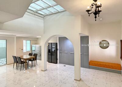 Modern kitchen and dining area with skylight