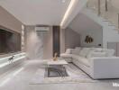 Modern living room with white sofa and marble accents