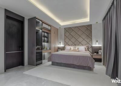 Modern bedroom with a bed, nightstands, and built-in shelving