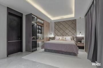 Modern bedroom with a bed, nightstands, and built-in shelving