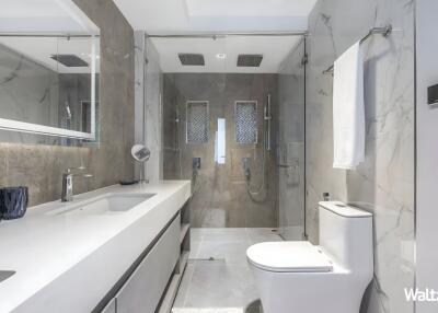 Modern bathroom with walk-in shower and double sink vanity