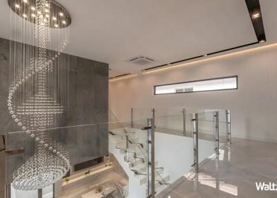 Modern stairway with hanging chandelier