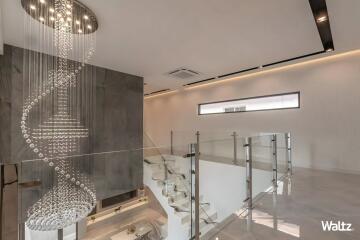 Modern stairway with hanging chandelier