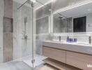 Modern bathroom with glass shower and double sink vanity