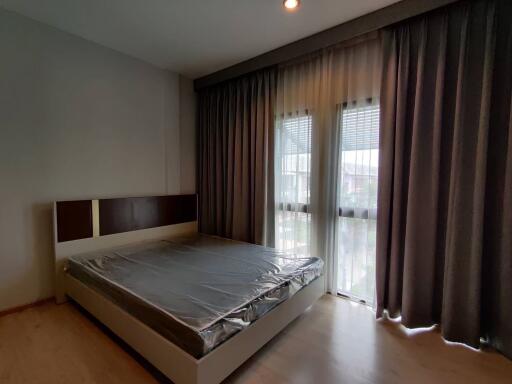 Bedroom with window and curtains