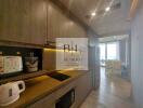 Modern kitchen with wooden cabinetry and appliances