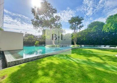 Spacious backyard with pool and greenery