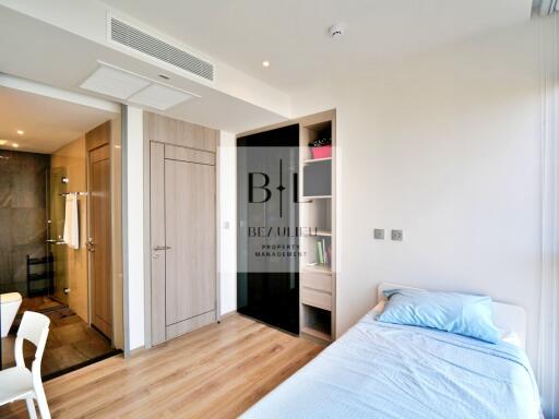 Cozy and modern bedroom with built-in storage and en-suite bathroom