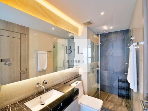 Modern bathroom with glass shower and sink