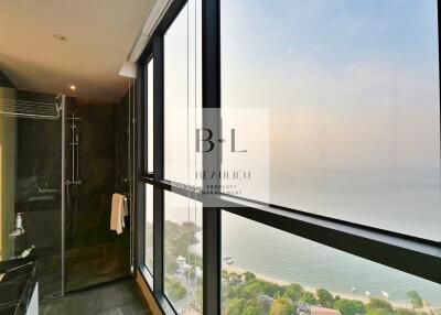 Bathroom with large windows and sea view