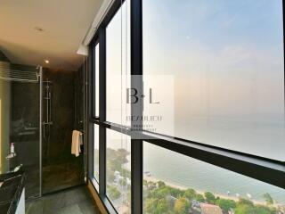 Bathroom with large windows and sea view