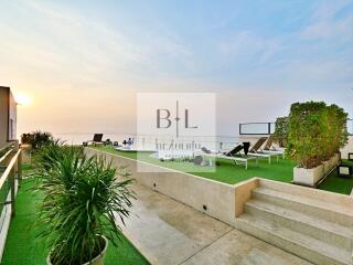 Spacious terrace with lounge chairs and ocean view