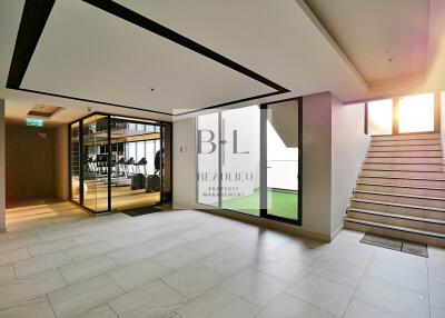 Modern lobby with gym view and stairs