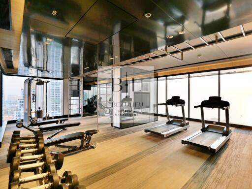 Spacious gym with modern equipment and panoramic city views