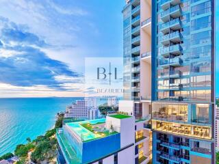 Luxury high-rise building with swimming pool overlooking the ocean