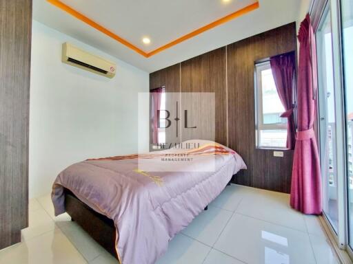 Modern bedroom with air conditioning and large windows