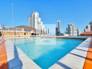 Rooftop swimming pool with city skyline view