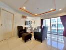 Modern living room with seating area and large windows