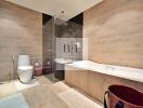 Modern bathroom with a glass-enclosed shower, bathtub, and toilet