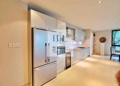 Modern kitchen with stainless steel appliances and sleek cabinetry