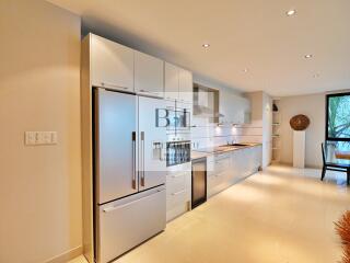 Modern kitchen with stainless steel appliances and sleek cabinetry