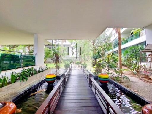 Outdoor common area with walkway and water features