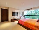 Spacious and well-lit bedroom with large windows and modern furnishings