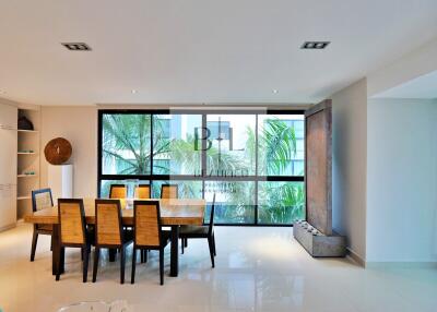 Modern dining area with large windows and contemporary decor