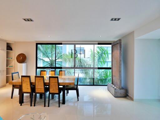 Modern dining area with large windows and contemporary decor