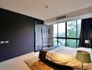 Modern bedroom with large windows and natural light