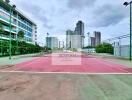 Outdoor tennis court near buildings