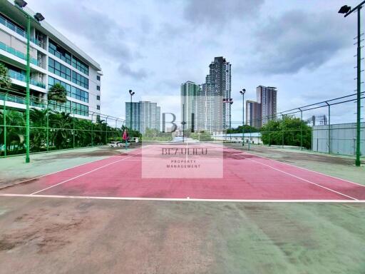 Outdoor tennis court near buildings