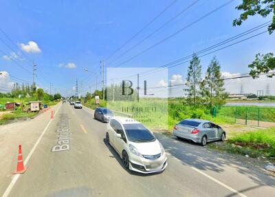 Street view with cars and greenery