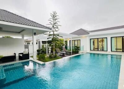 Outdoor area with pool and seating