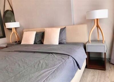 well-furnished bedroom with double bed and stylish lamps