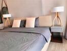 well-furnished bedroom with double bed and stylish lamps