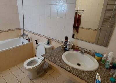 Bathroom with tub, toilet, and sink