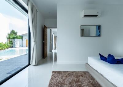 Modern bedroom with pool view