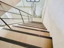 Staircase with glass railing in modern building