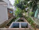 Outdoor garden area with water feature and plants