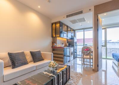 Modern open living and dining area with balcony view