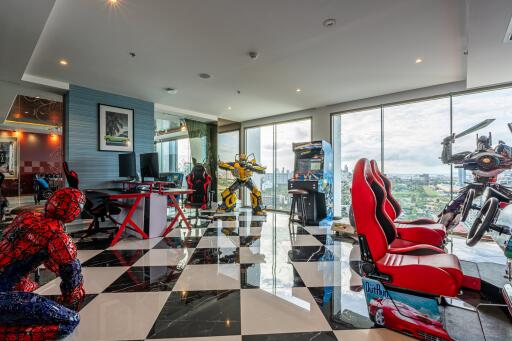 Entertainment room with gaming setups and action figure displays