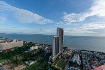 Aerial view of a coastal city with high-rise buildings