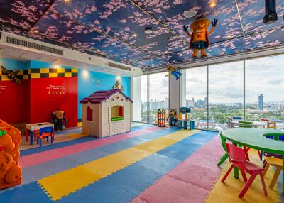 Colorful playroom with toys and large windows